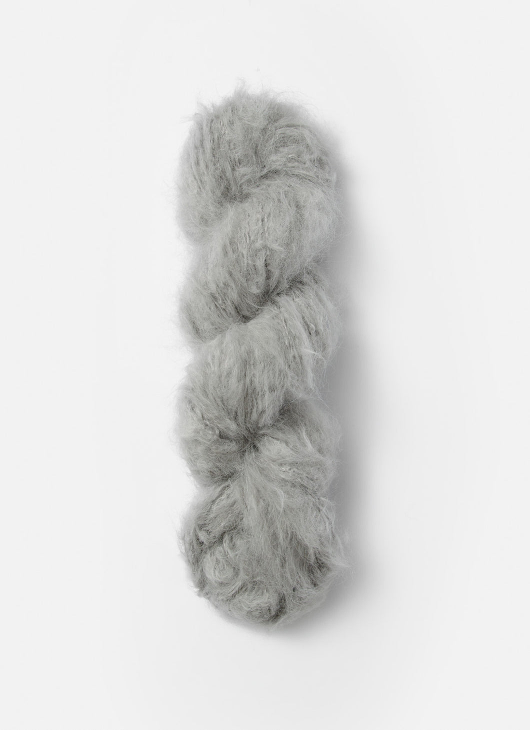 A skein of  Blue Sky Fibers Brushed Suri alpaca yarn in Earl Grey from Green Gable Alpacas.