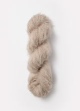 Load image into Gallery viewer, A skein of  Blue Sky Fibers Brushed Suri alpaca yarn in Toasted Marshmallow from Green Gable Alpacas.

